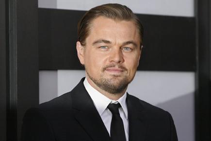 DiCaprio challenged to buy Nelson Mandela's photo